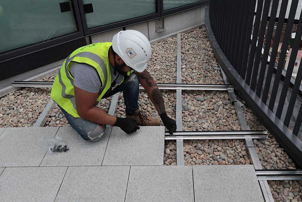 Paving being laid on rail system