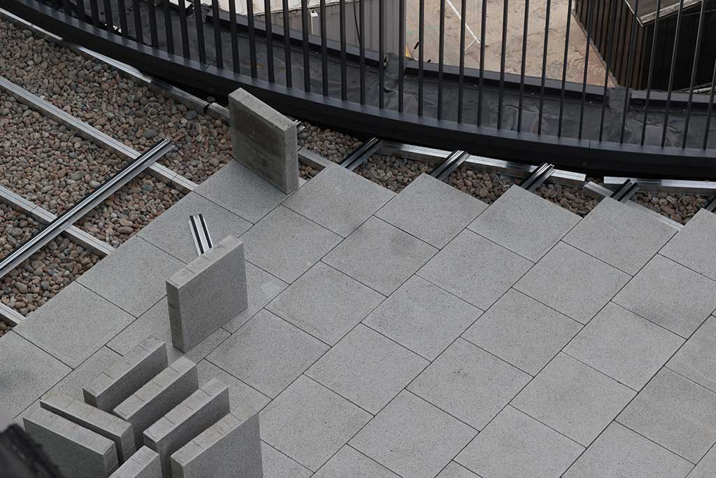 Paving being laid on rail system