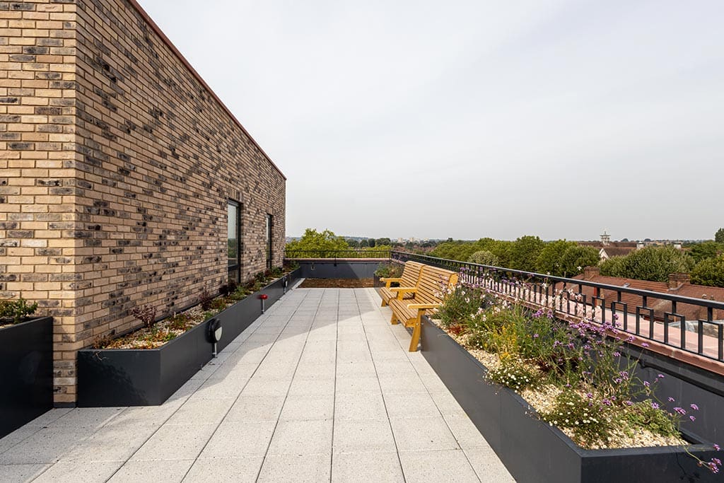 Walkway with planters and bench
