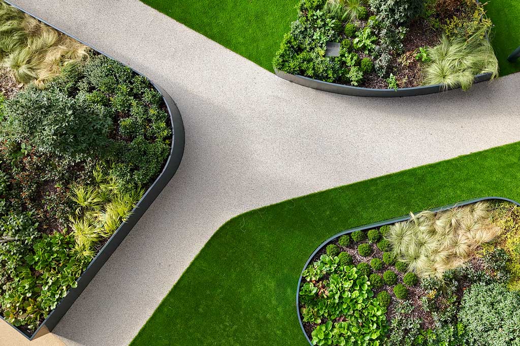 Aerial view of planters, grass, and path