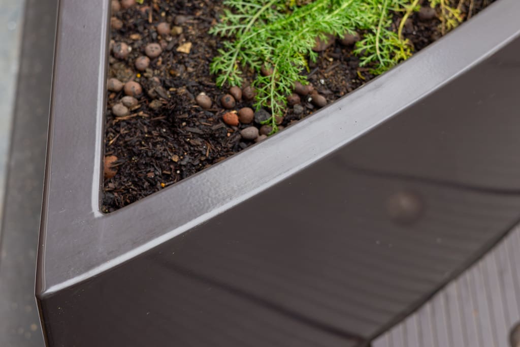 Egyptian & Dudley House planter close-up