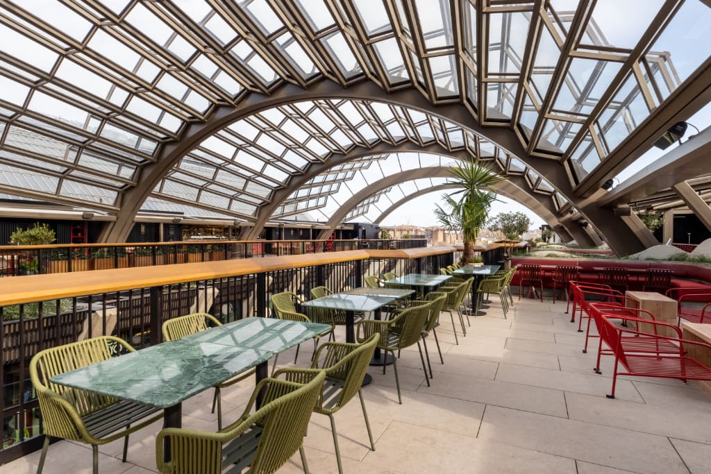 Glass canopy over paved seating