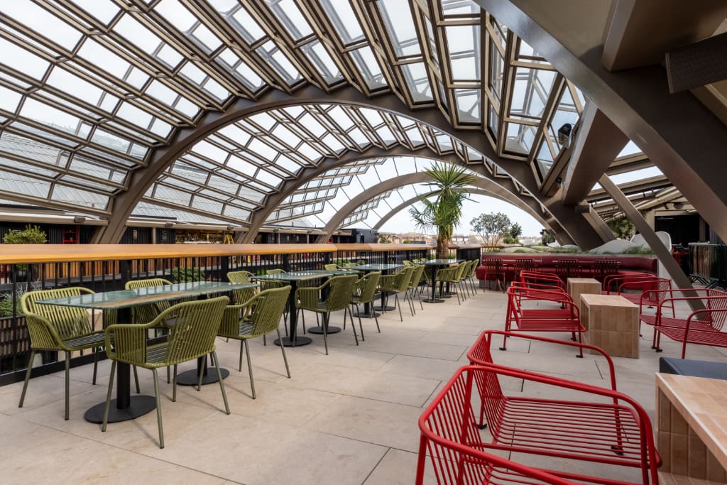 Glass canopy over paved seating