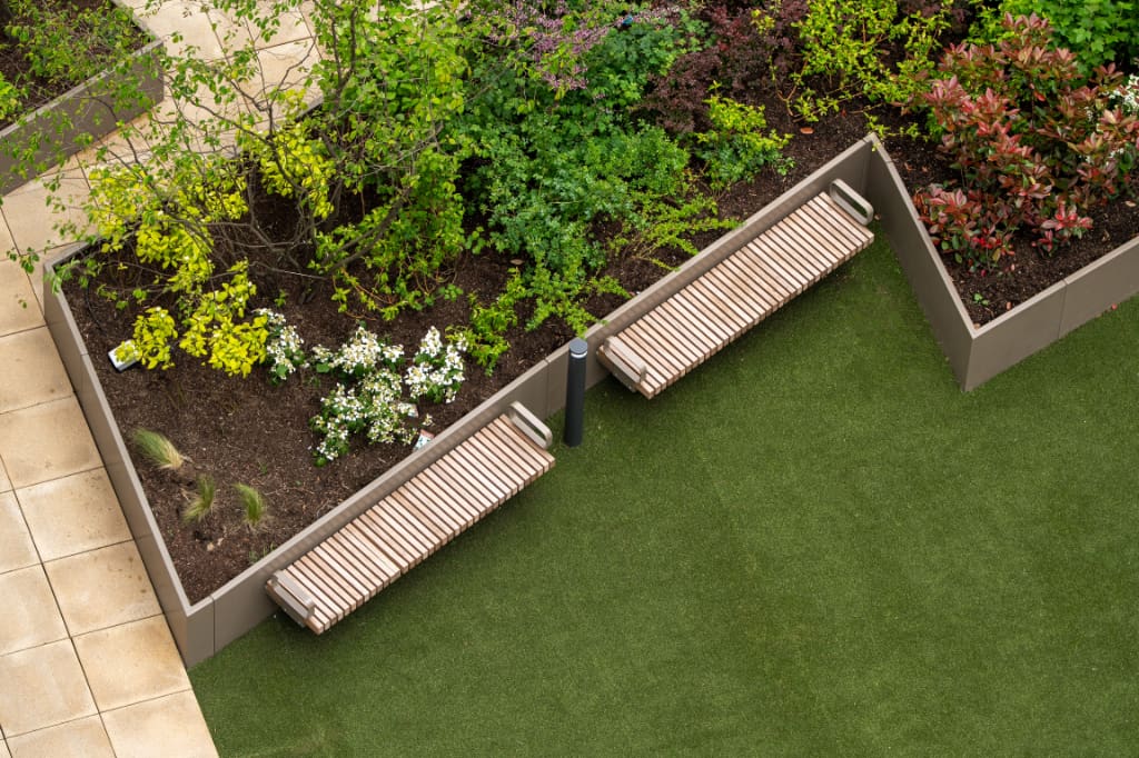 Planters, benches, and artificial grass