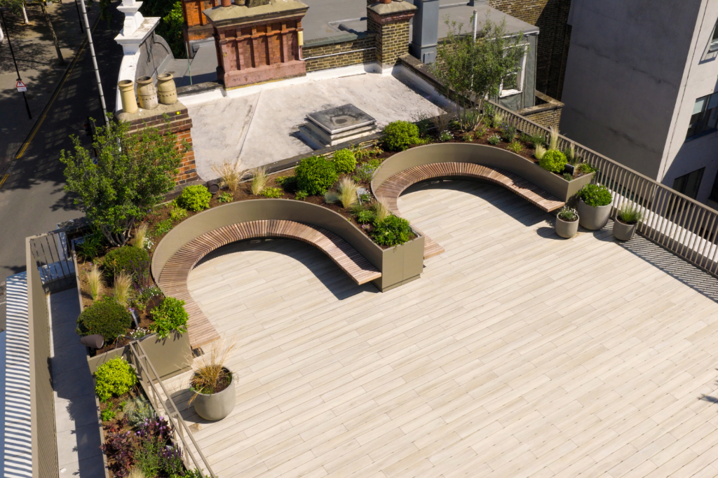 Decked roof terrace with seating and planters