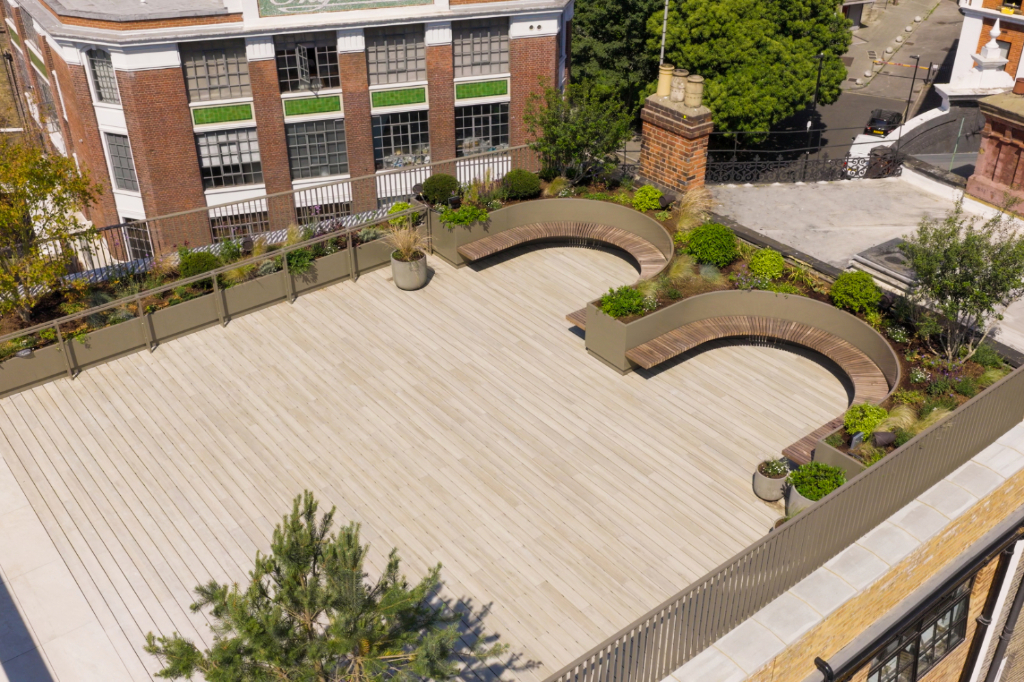 Decked roof terrace with seating and planters