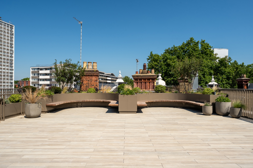 Decked roof terrace with seating and planters