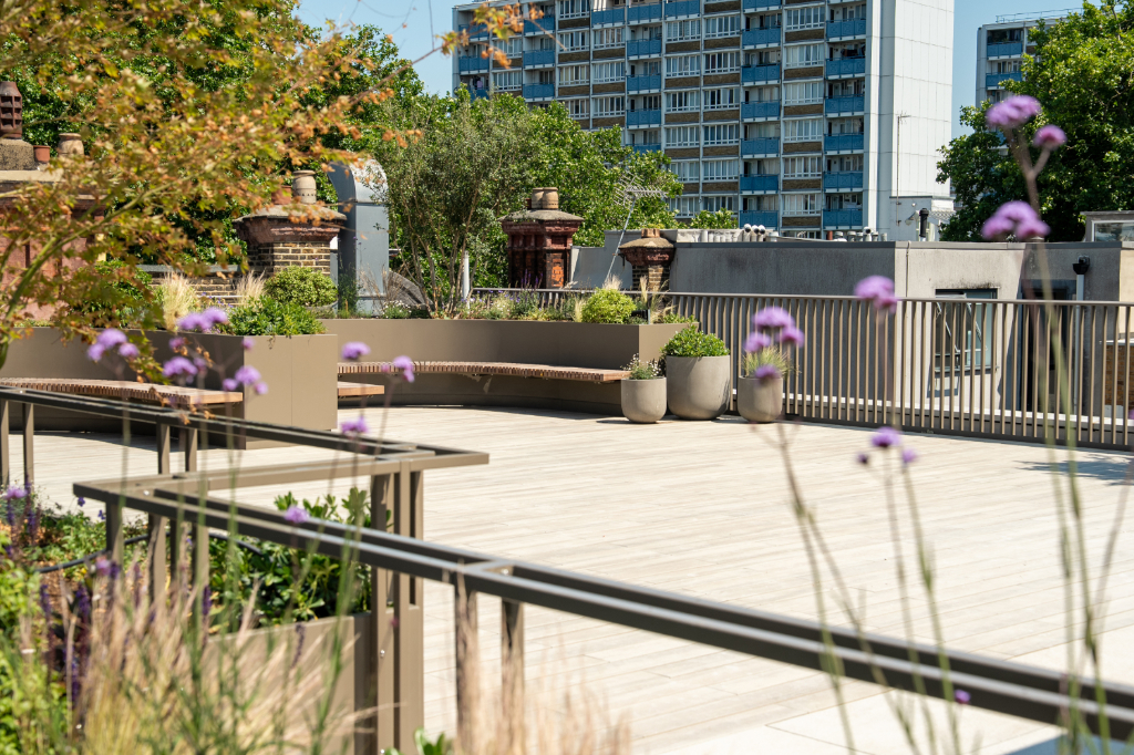 Decked roof terrace with seating and planters
