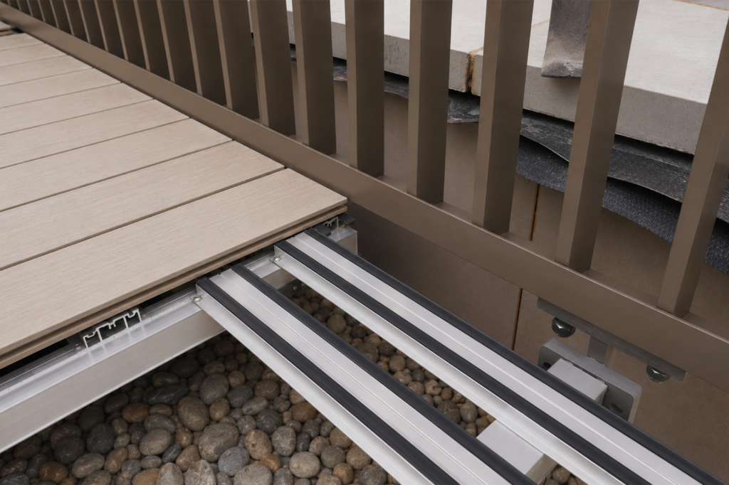 Decking rail system linked to balustrade with BaseLink