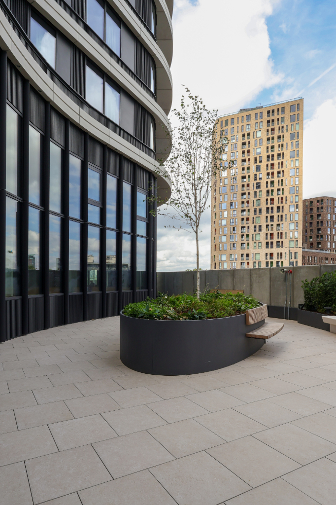 Paved courtyard with planters