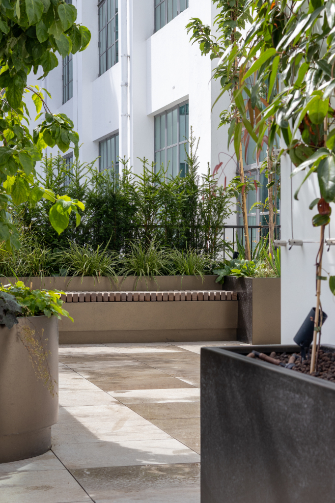 Planters on paved roof terrace