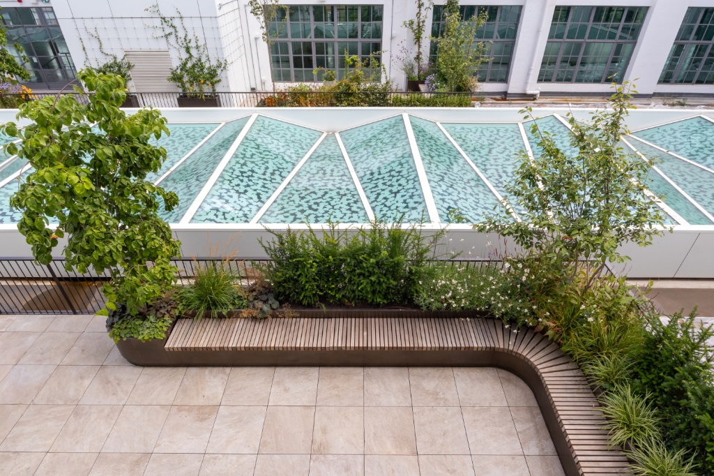 Paved roof terrace, seating, and planters